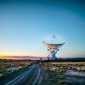 Photo by Donald Giannatti white radar telescope on grass field