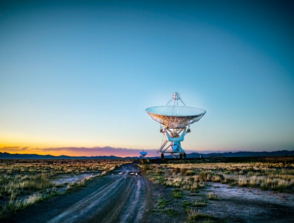 white radar telescope on grass field