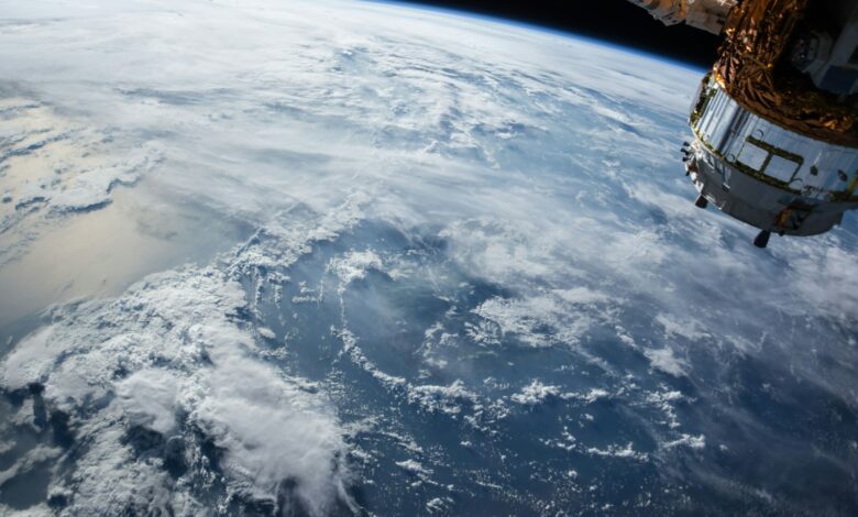 view of Earth and satellite